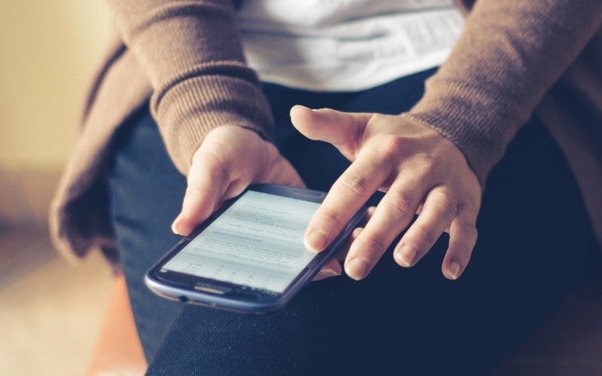 Woman scrolling through phone, machine learning