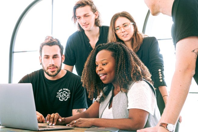 Group looking at computer