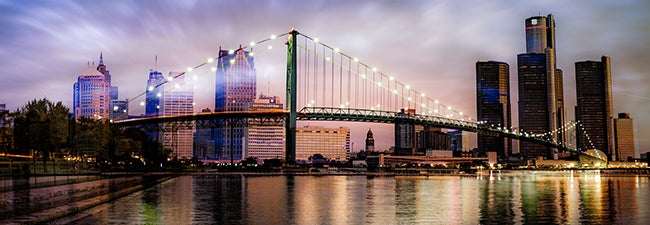 Photo of the Ambassador Bridge with the Detroit skyline as a backdrop.