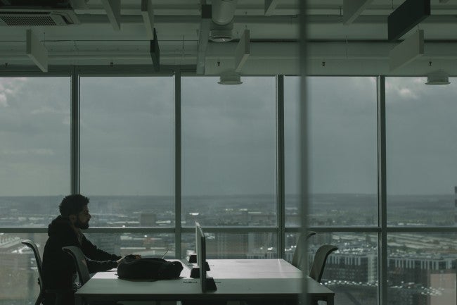 CIO in front of large window
