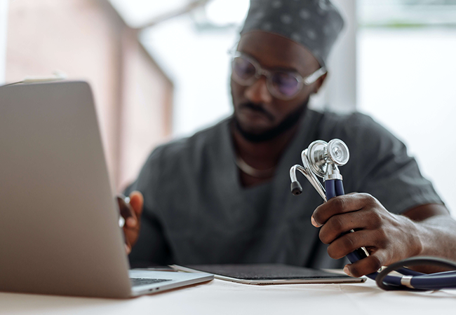 doctor looking at files protected by HIPPA
