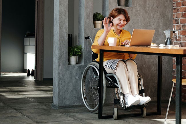 woman in wheelchair talking on video call