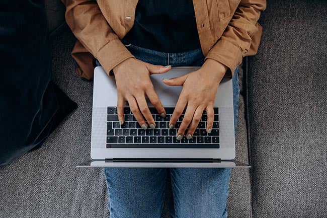 typing on laptop
