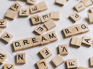 Dream Big spelled out with Scrabble tiles