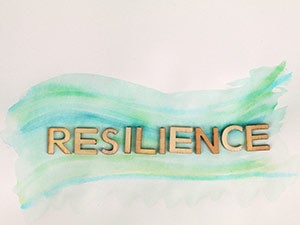 Resilience spelled out on a green background