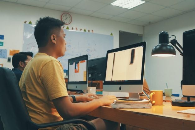Boy at computer in a classroom