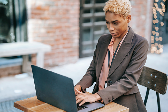 professional woman typing at computer
