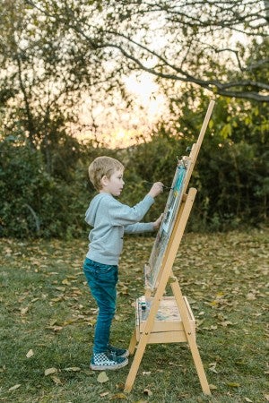 child painting outside