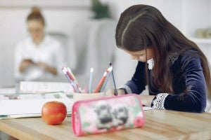 child studying at home