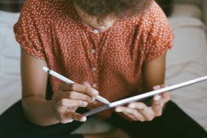 person using a pen on a tablet
