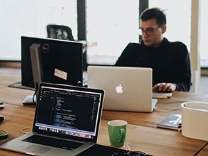 student studying at laptop