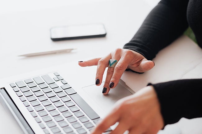 someone typing on the laptop
