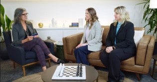 Marni Baker Stein leading a discussion with two other people sitting on a couch
