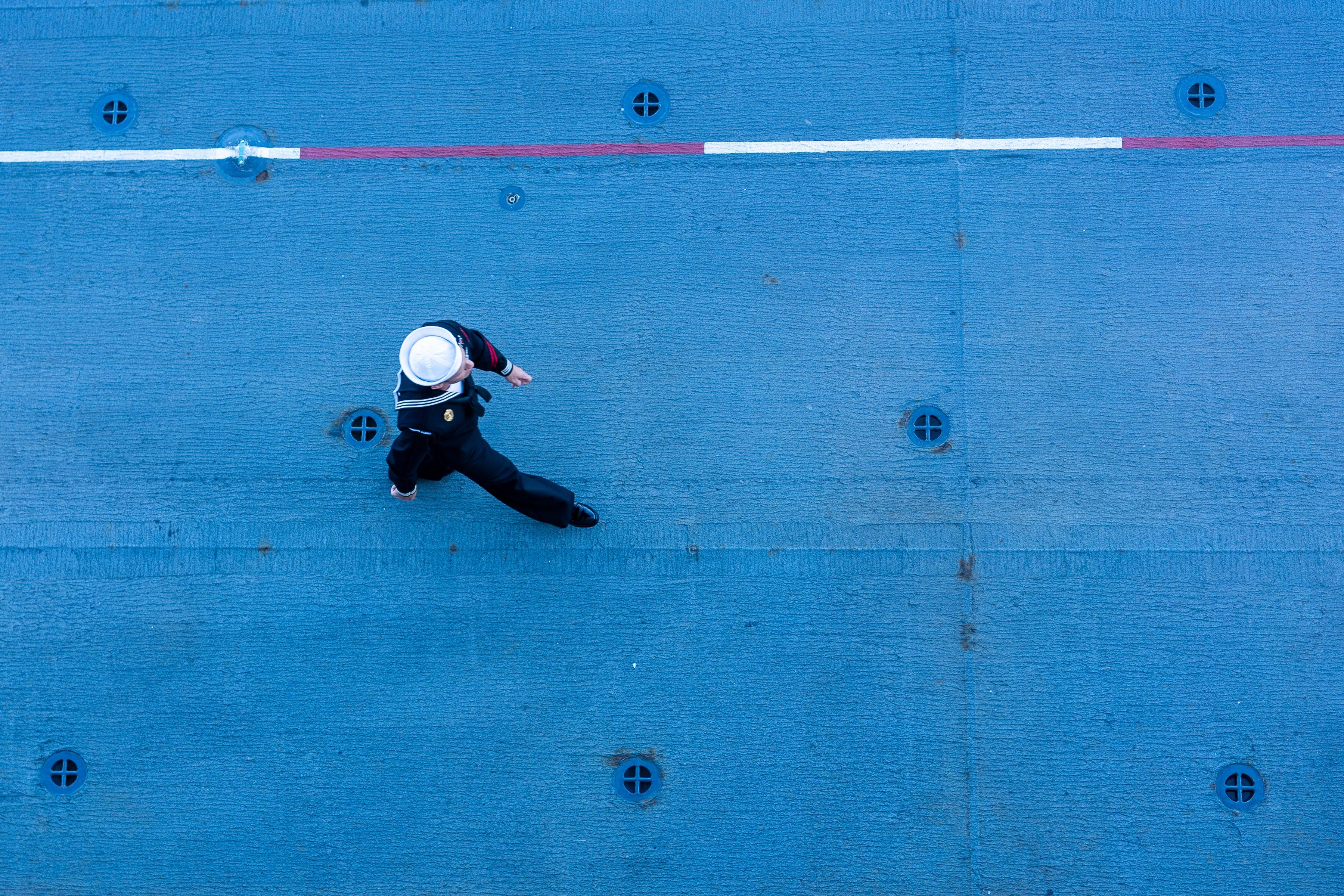sailor walking on ship deck