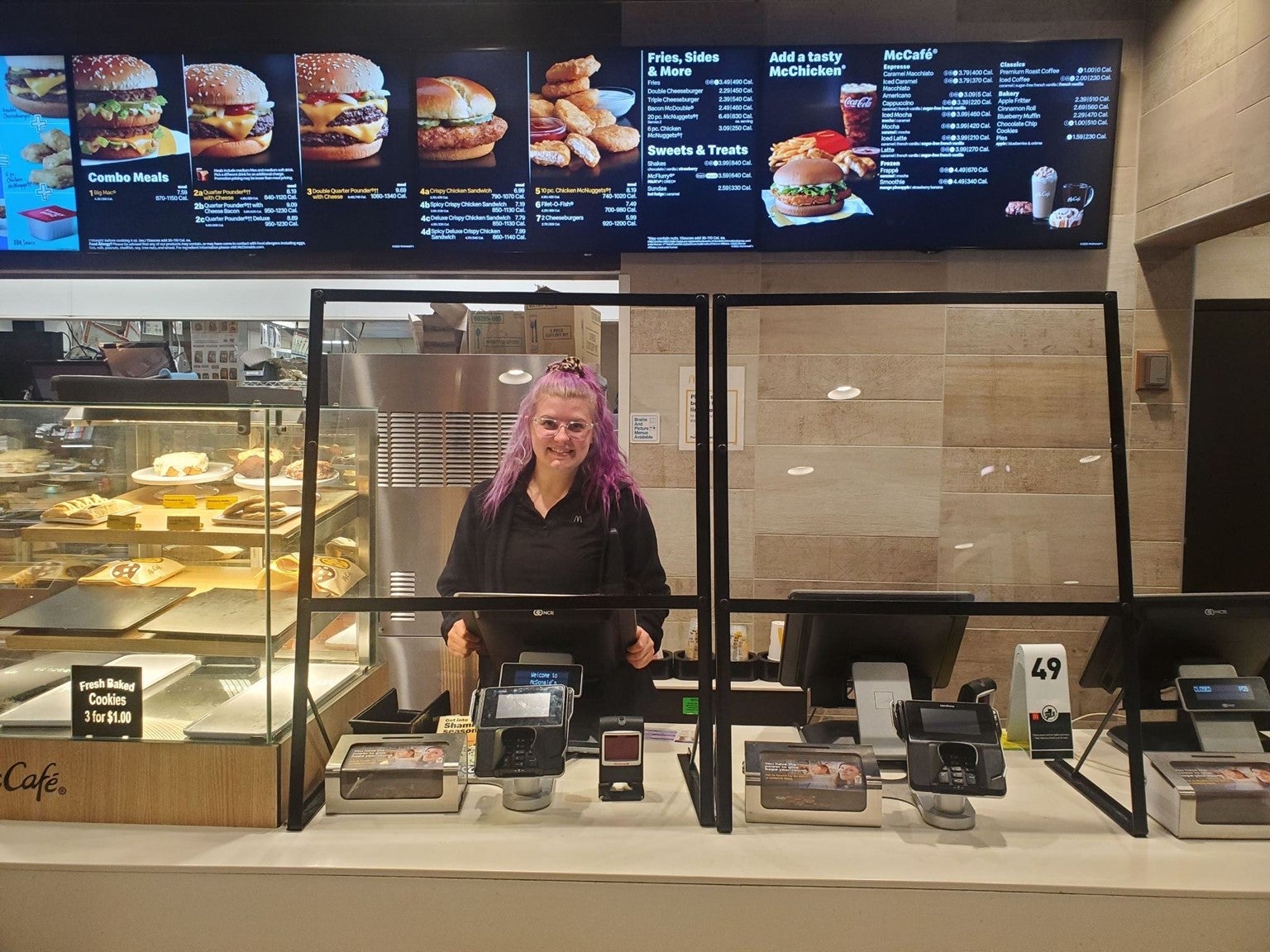 Kassie Johner stands behind a counter at a McDonald's restaurant.