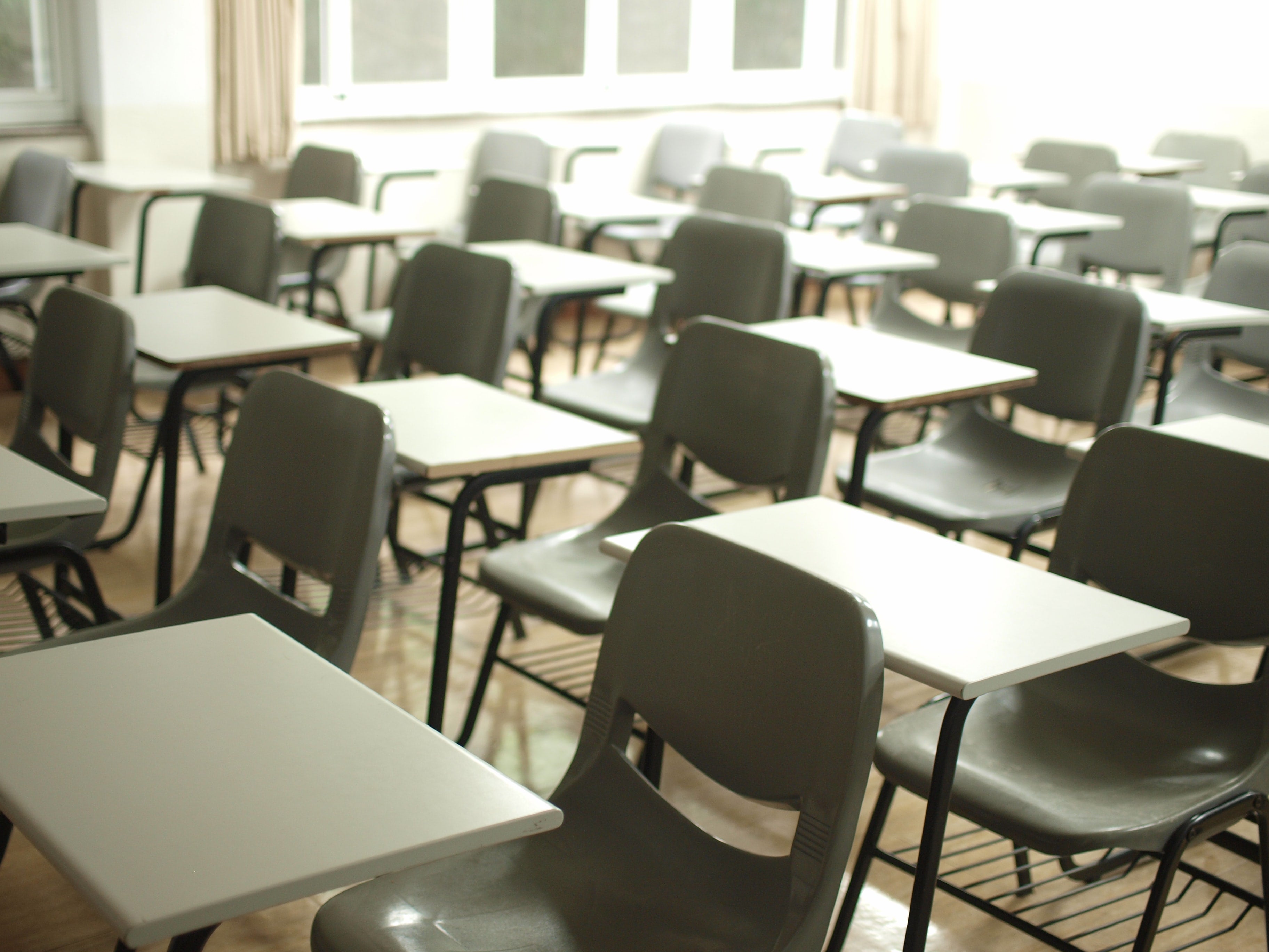 Classroom with empty desks and chairs