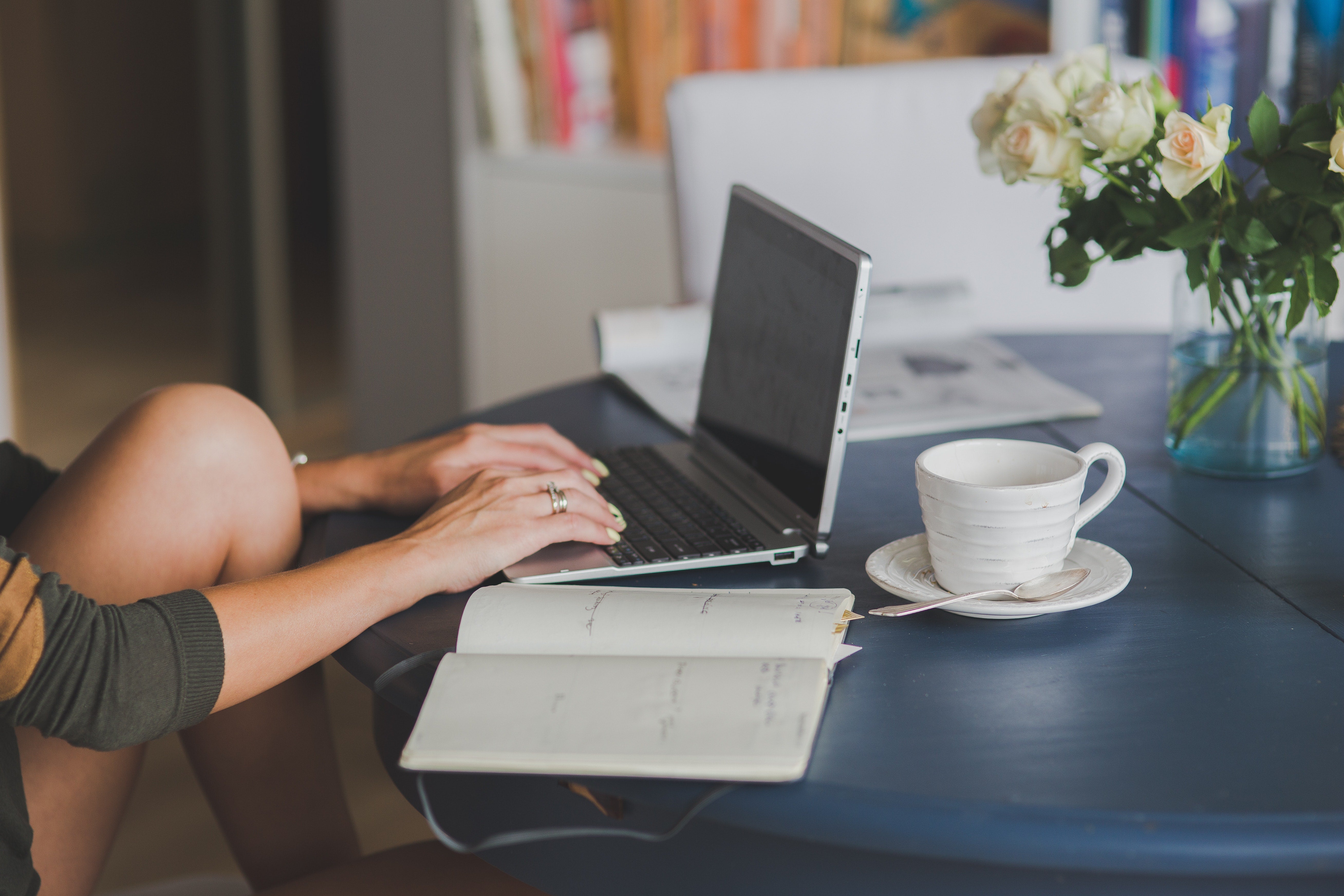 person typing on a laptop