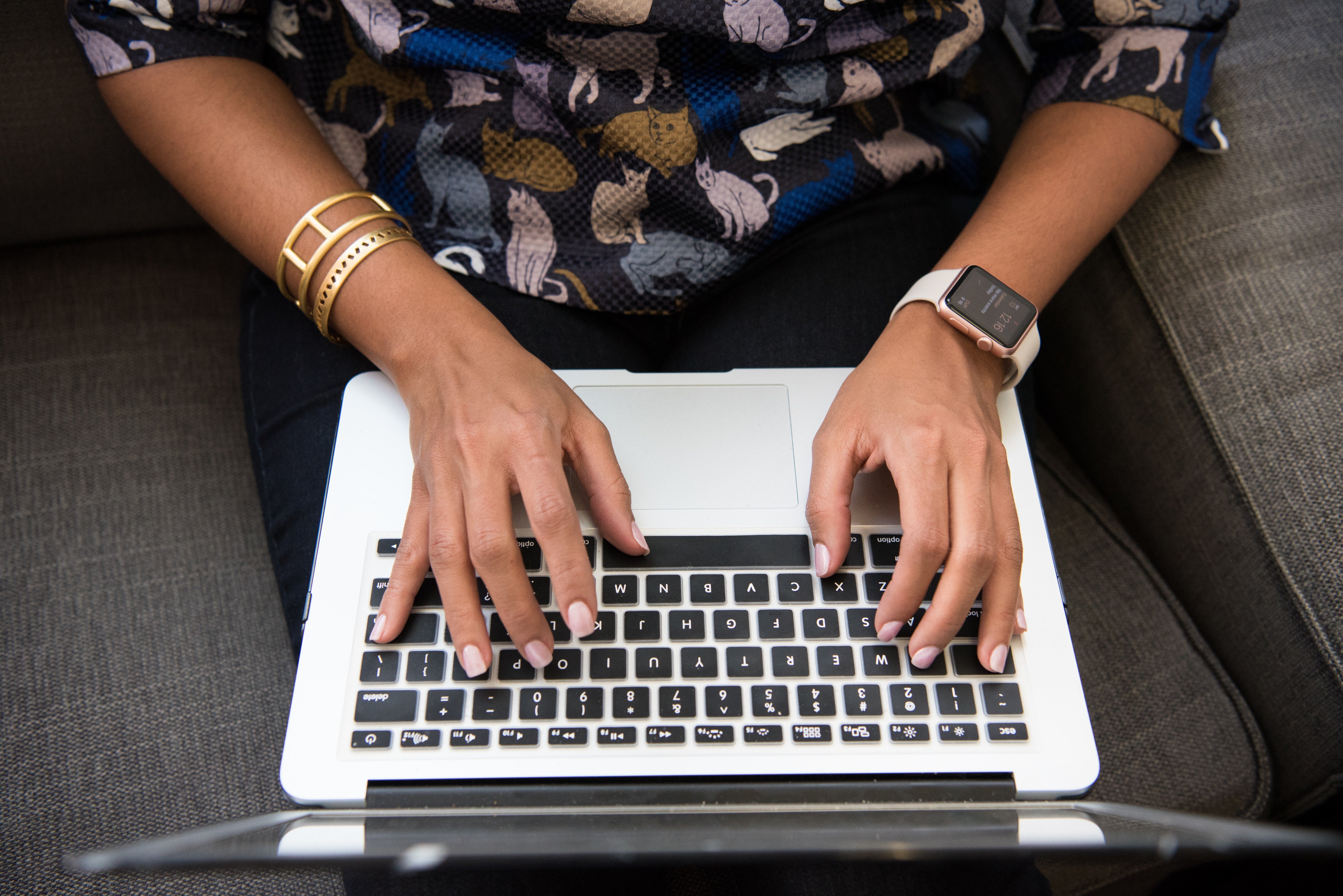 person typing on a laptop