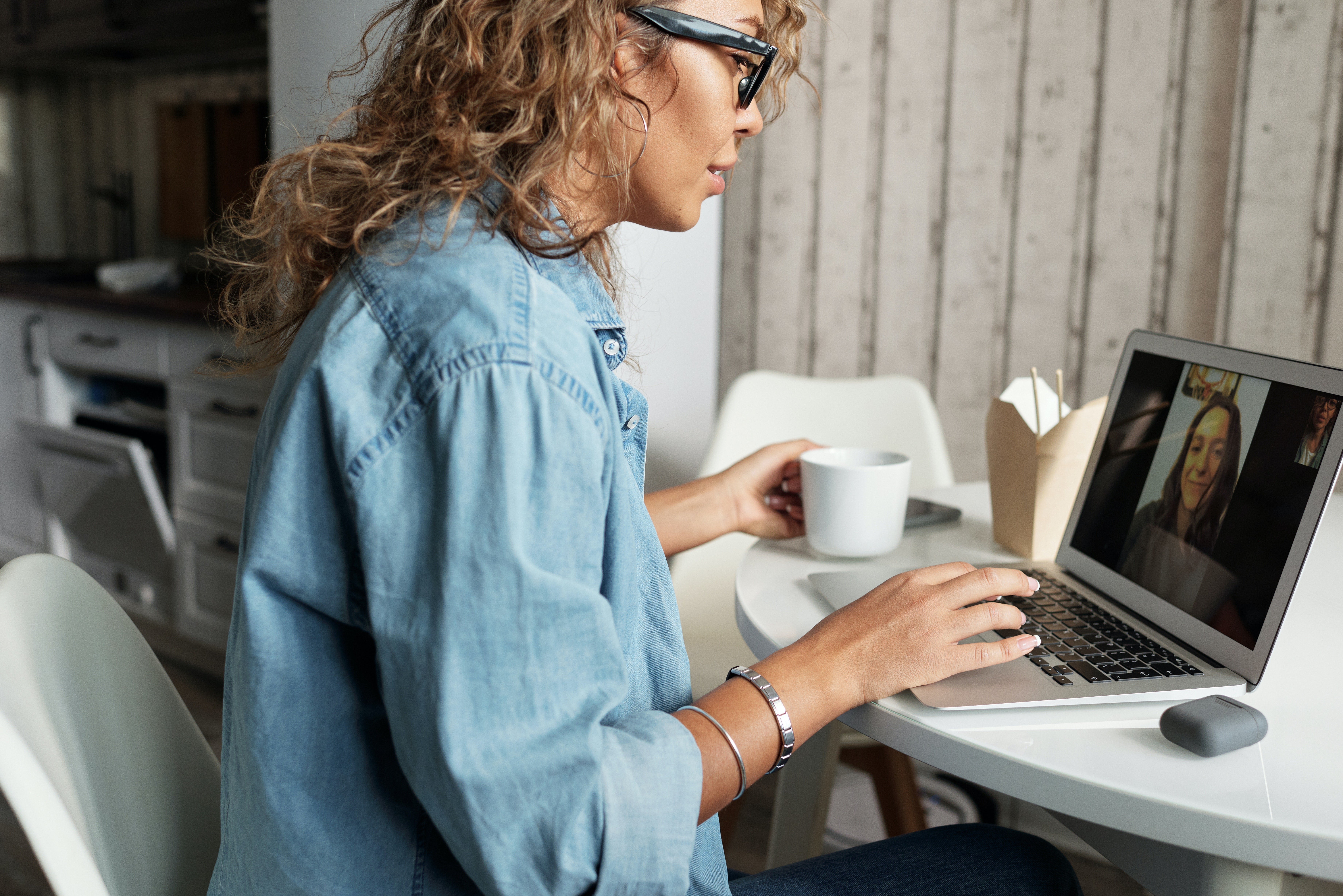 person sitting at a desk having a video call