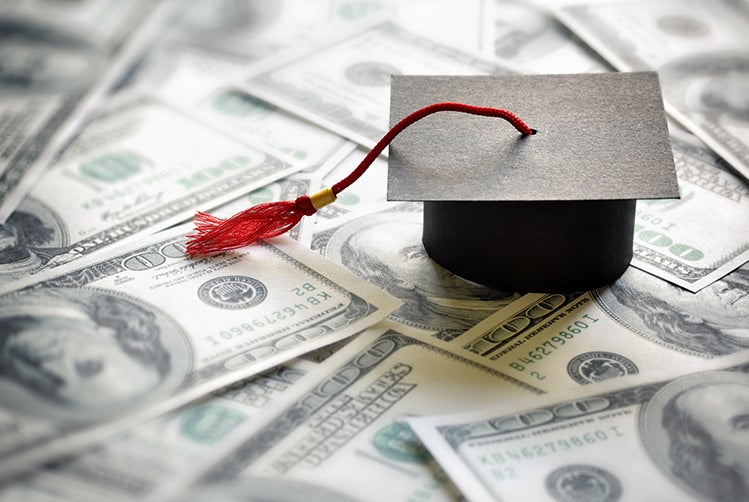 grad-cap-on-money