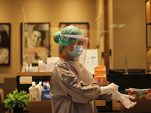registered nurse wearing PPE