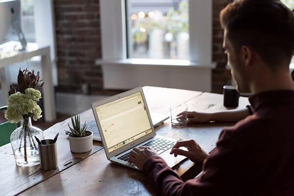 Man at a laptop at home