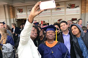 WGU grad and friend pose for a selfie