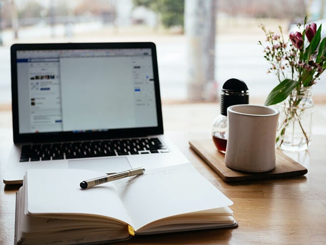 Laptop, coffee and journal