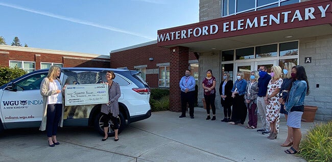 Waterford Elementary teachers cheer for scholarship recipient