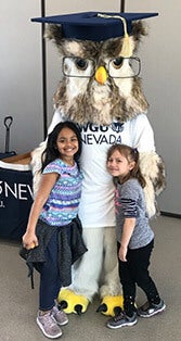 Sage poses with reading week participants