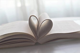 Open book with pages in heart shape