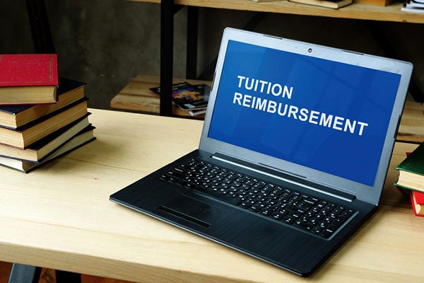 Laptop showing the words Tuition Reimbursement