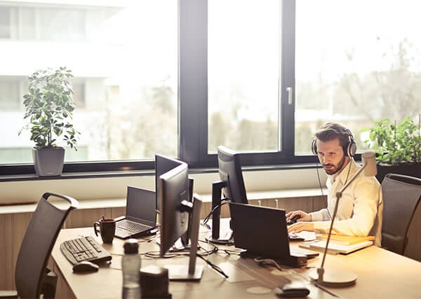 Man with headphones and a computer