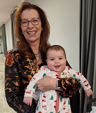 Estep holding a baby