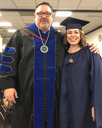 WGU Texas Chancellor Johnson with graduate and employee Kristian Fitzgerald.