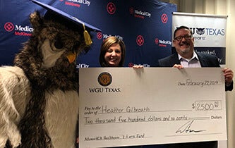 Heather Gilbreath poses with Sage and WGU Texas Chancellor Steven Johnson.