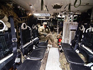 Military member in a cargo plane