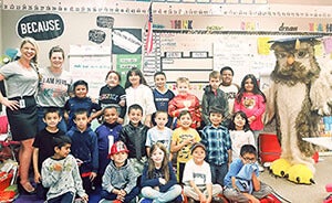 Teacher receives Share the Love recognition.