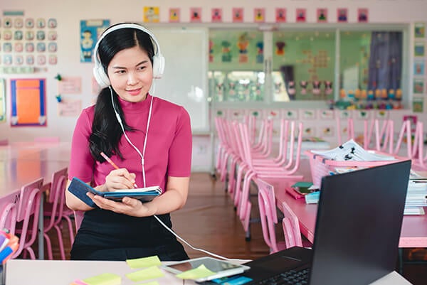 Woman teaching online from her classroom