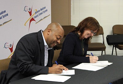 Officials signing the agreement