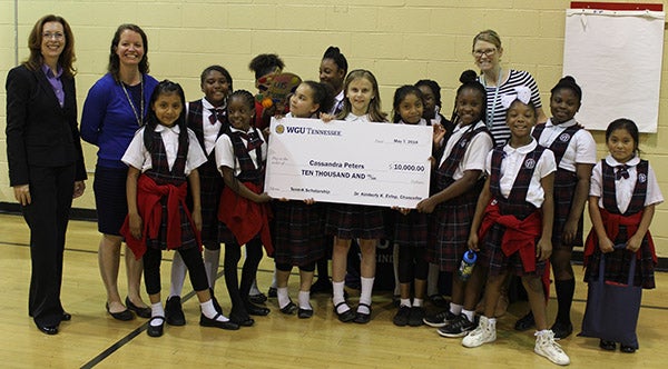 peters students holding check
