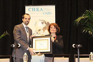 Lucas Kavlie of Western Governors University receives the CIQG Quality Award from CHEA Senior Advisor on International Affairs Stamenka Uvalić-Trumbić.