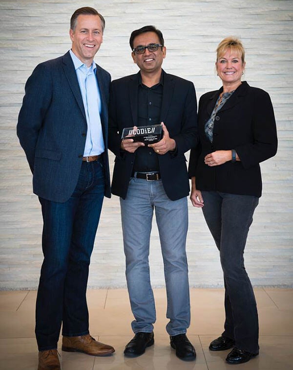 Receiving the CODiE Award are (L to R) Scott Pulsipher, President of WGU, Manish Gupta, CEO of uCertify, and Elke Leeds, Academic Vice President of WGU's College of IT.