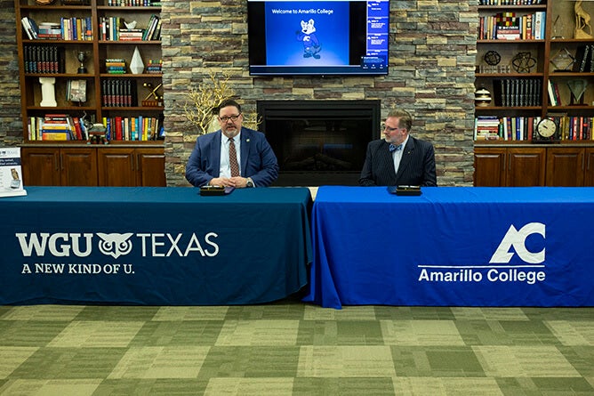 WGU Texas Chancellor Steven Johnson signs the agreement with Amarillo College