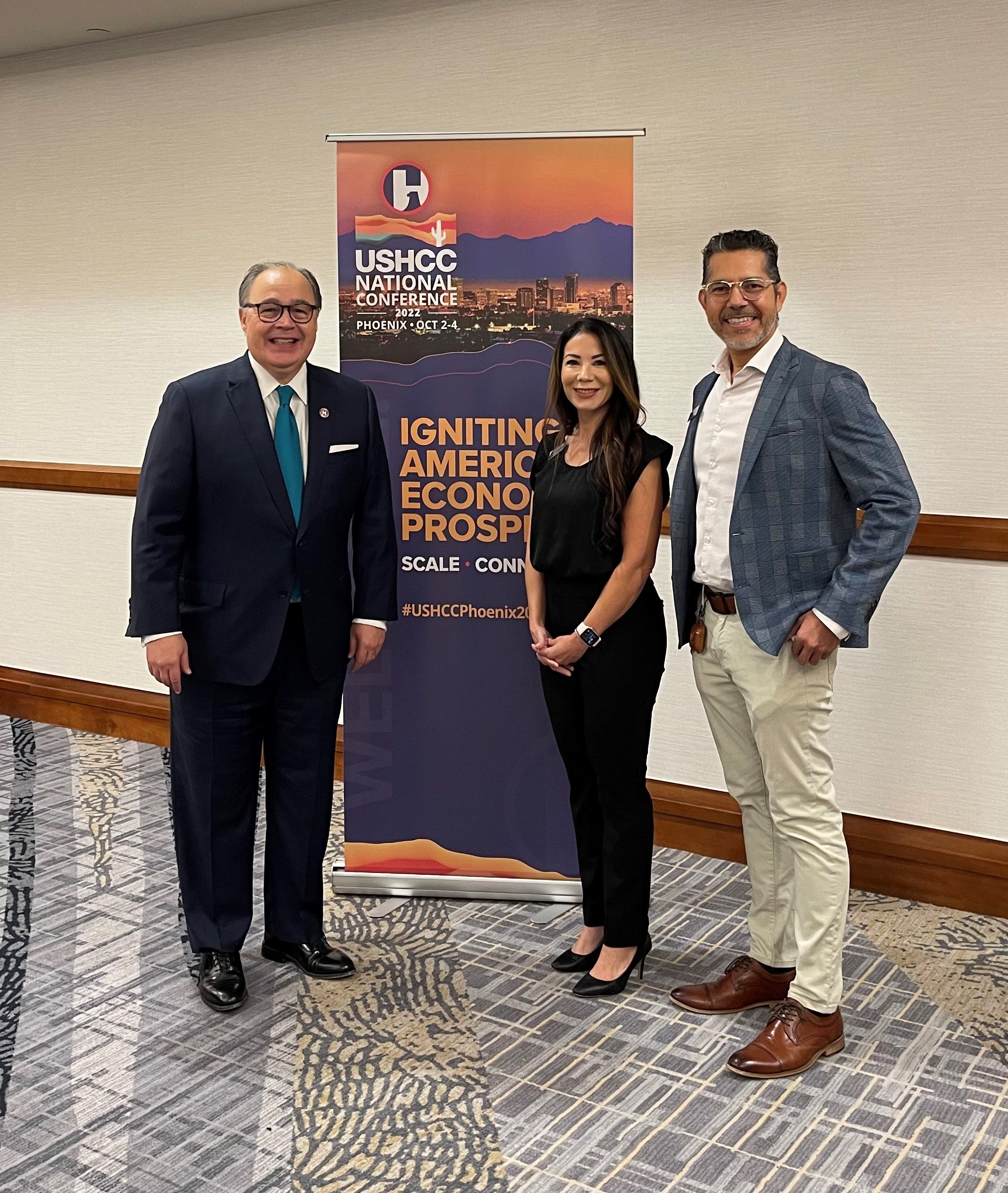 United States Hispanic Chamber of Commerce President and CEO Ramiro A. Cavazos, left, stands with Western Governors University’s Strategic Partnerships Manager Nikki Torres and Director of Regional Operations Ismar Vallecillos at the Chamber’s annual convention in Phoenix, Arizona, Tuesday, Oct. 3rd.