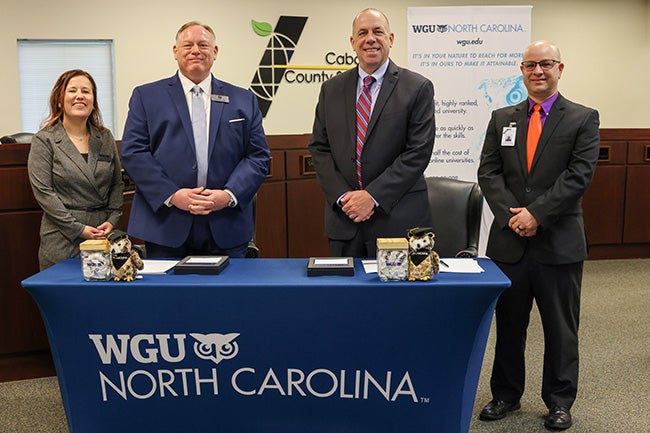 Representatives from WGU NC and Cabarrus County Schools pose for a photo after signing a partnership agreement.