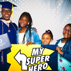 WGU grad with his family