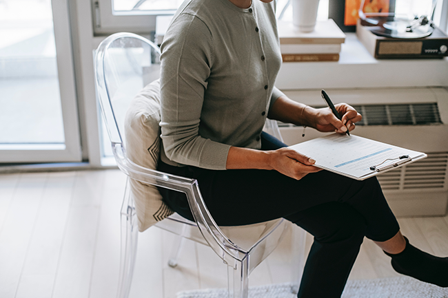 woman taking notes