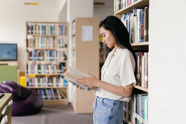 Woman reading in library