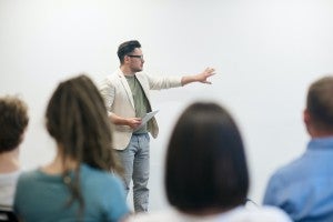 male teacher in front of class